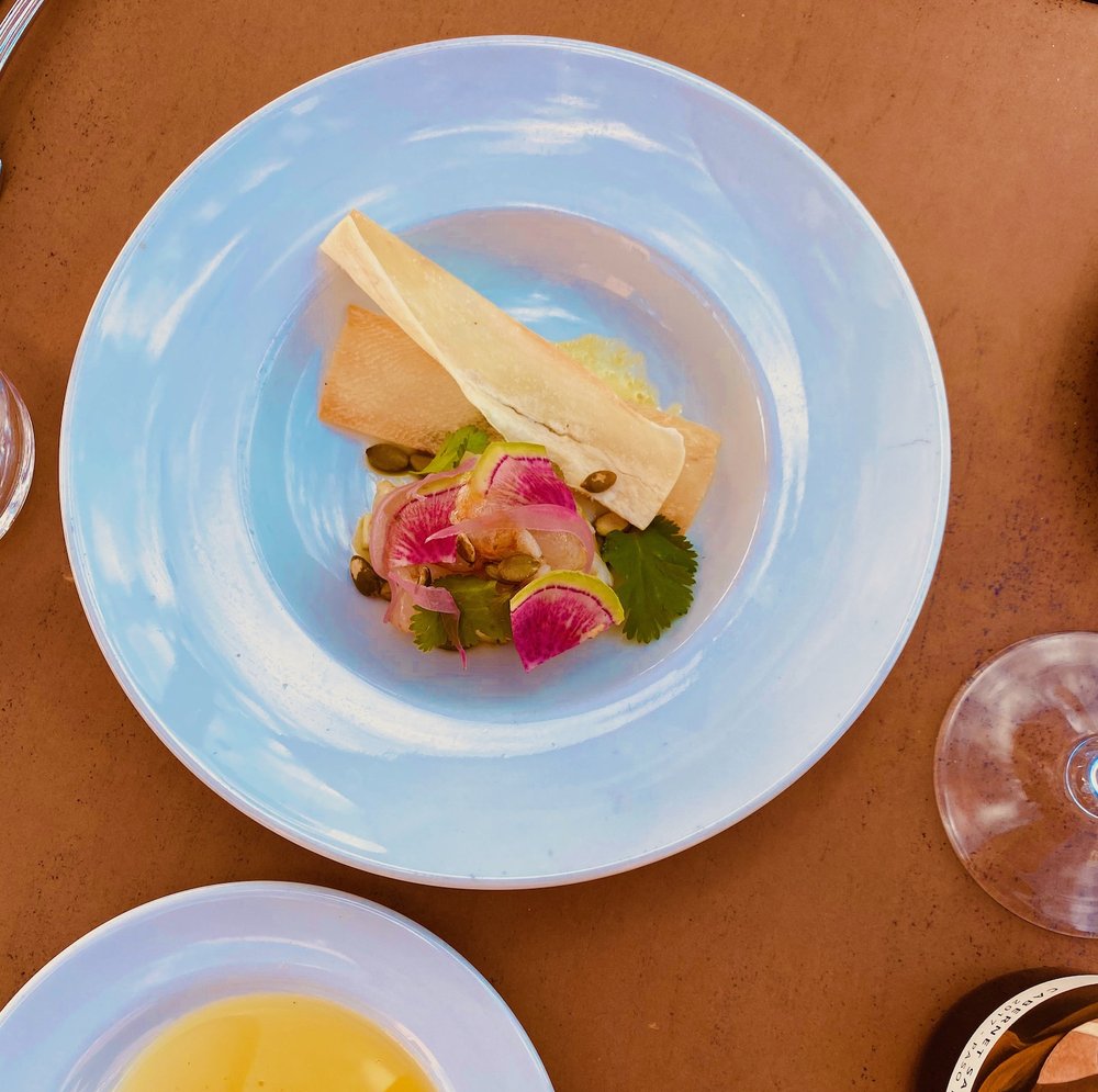 Chilled crudo with pickled radish, pepitas and cilantro